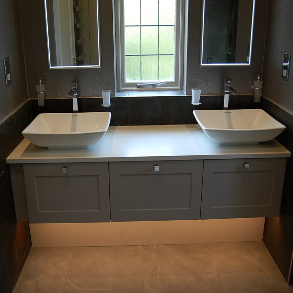 double sink with solid surface top and painted shaker style drawers